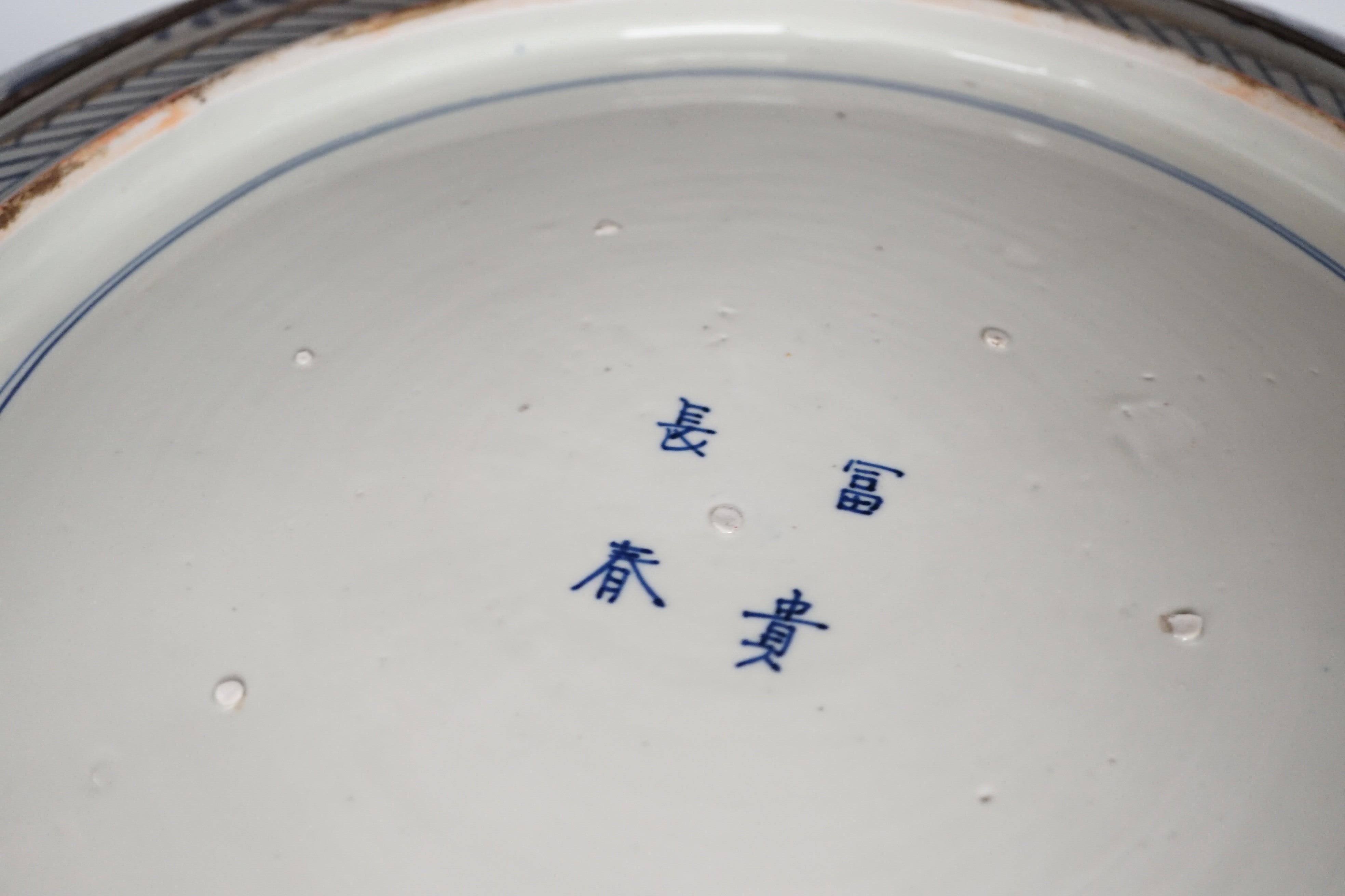 A massive Japanese Arita 'Seven Gods of Happiness' dish, Meiji period, 60.5cm.